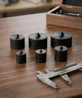 Top Tier Industrial Shaft End Protector Kit With 6 Heavy Duty Metal Spindle Caps For Grip O Matic Pullers To Shield Machine Axles And Slash Vibration Noise, six black metal caps on wood