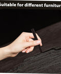 Hand using 2 Pack Wood Filler Sticks for Furniture Repair Scratch Remover Pens Quick Fix Paint Markers on wooden surface