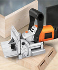 Heavy Duty Electric Tenoning And Mortising Machine With Biscuit Jointer Slotting Tool For Cabinet And Furniture Work, shows precision cutting on wood.