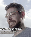 Outdoor Safety Sunglasses For Work And Play With Smoke Lenses, UV 99.9 Percent Protection, shown on a person outdoors, wraparound design
