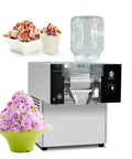 Commercial Snowflake Ice Machine Making Two Seventy Five Pounds Daily Automatic Shaved Ice Maker With quick chill, with pink shaved ice and cups.