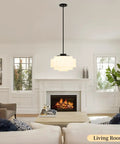 puncoll Vintage Black Milk Glass Pendant Light, 15.7'' White Chandelier hanging in a cozy living room with a fireplace.