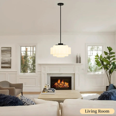 puncoll Vintage Black Milk Glass Pendant Light, 15.7'' White Chandelier hanging in a cozy living room with a fireplace.