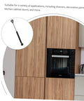 Gas spring hinge for cabinet doors; black cylindrical actuator with metal mounting, for soft-close.