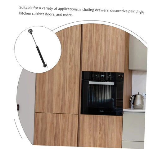 Gas spring hinge for cabinet doors; black cylindrical actuator with metal mounting, for soft-close.