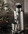 Badass Electric Burr Coffee Grinder With 80mm Flat Burrs And Single Dose Setup For Knocking Out Espresso Daily on a countertop.