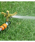 Game Changing Garden Sprinkler With 360 Degree Rotating Irrigation System for Lawn Farm spraying water on green grass
