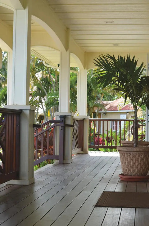Wooden deck with railing and potted plant, suitable for Deck Drive Wood Screws Collated 8 By 1 And 5 Eighths Inch Torx T25 6 Lobe Tan.
