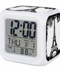 Solid Vintage Cube Alarm Clock Bringing A Sharp Vibe To Desks With Seven Color Night Light And Quick Snooze Feature Offering Straight Up Time Date Temperature Readout For Bedroom Or Office Use. White cubic clock with Paris design.