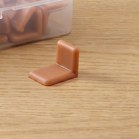 Universal L Shape Drawer Glides Kit 50 pieces tack in drawer sliders for furniture showing one brown plastic glide on a wooden surface