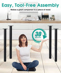 Image of a woman sitting by a table with 28 Inch Adjustable Metal Desk Legs Set Of 4 Heavy Duty Steel Feet For DIY Projects