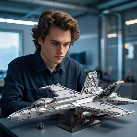 Person assembling F-18 Hornet Fighter Jet Building Set With 1,387 Pieces Display Stand Movable Wings Retractable Landing Gear