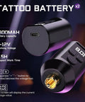 Wireless Rotary Tattoo Starter Kit For Beginners With Dual 1800mAh Batteries showing charging port and display screen.