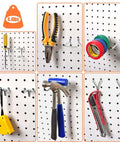 Pegboard Hooks And Accessories Kit For 1/8 Inch And 1/4 Inch Pegboards, 38 Piece Set with tools organized on a wall