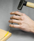 Sunny Biscuit Connector For Size 20 Slide In Wood Joiner being installed with a hammer on a wooden board