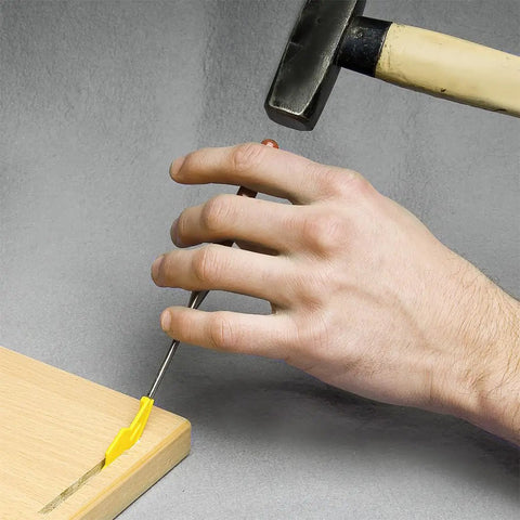 Sunny Biscuit Connector For Size 20 Slide In Wood Joiner being installed with a hammer on a wooden board