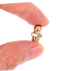 Close-up of a brass grease fitting held between fingers from Grease Zerk Fitting Assortment Kit With Angled Nozzles SAE Brass Angled Grease Tips For Auto And Industrial Use 25 Piece Multi Use Gun Accessory Set For Professionals