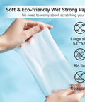 Close-up of a Lulumonster anti-fog lens wipe, large 5.1 x 5.9 in, pre-moistened wipe held