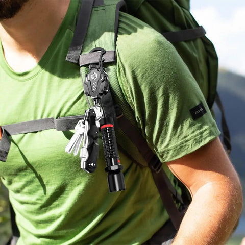 Person wearing a backpack with 2 Pack Heavy Duty Retractable Keychain And Badge Reel Carabiner With Magnetic Closure attached