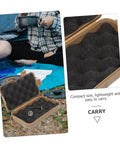 Rugged Survival Storage Box With Shockproof Organizer for outdoor tools on grass, open with black foam interior and compass inside.