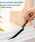 Hand using a small crevice brush for detail cleaning along window tracks, showcasing precise cleaning capability.