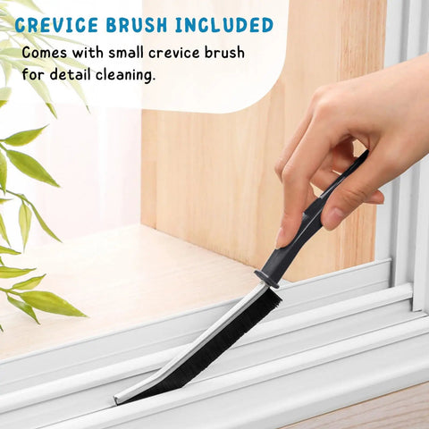 Hand using a small crevice brush for detail cleaning along window tracks, showcasing precise cleaning capability.