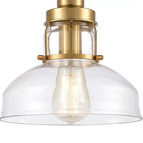 Manhattan Boutique Mini Pendant Light In Brushed Brass Finish With Clear Glass Sleek Modern Look Durable Steel Construction One Light Transitional Style 9 Inch Wide Hardwired Ceiling Fixture For Modern Living Rooms showcasing clear glass and brass detailing