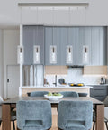 Brushed Nickel 5 Light Pendant Fixture Set For Kitchen Island hanging over modern kitchen table and chairs