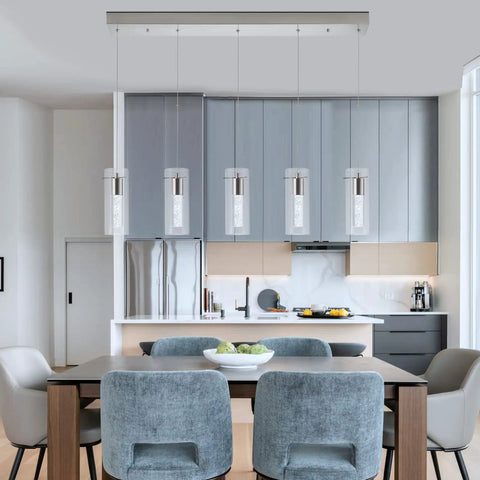 Brushed Nickel 5 Light Pendant Fixture Set For Kitchen Island hanging over modern kitchen table and chairs