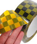Plaid Pattern Shipping Tape 2 Rolls Adhesive Sealing Packing Tape With Black Yellow Grid Design, hand holding tape edge.