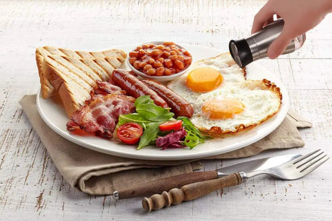 Go-To Salt And Pepper Shaker Set With Stainless Steel Caps And Glass Bottles seasoning breakfast platter with eggs and toast
