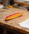 Magnetic for stud Finder for Drywall Screw Detection Magnetic(C) on a wooden workbench with tools nearby.