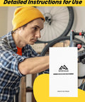 Cyclist using the DIY Friendly Hydraulic Disc Brake Bleed Kit For Shimano TEKTRO TRP with manual in a workshop setting.