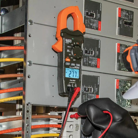 Digital Clamp Meter Workhorse With 400A Auto-Ranging Clamp, AC/DC Voltage, mounted on panel showing 277 volts