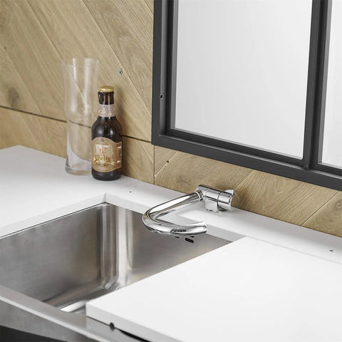 Premium RV Sink Faucet with Spotless Chrome Finish Heavy Duty 360 Swivel Marine Cold Water Tap Compact Deck Mount Setup for Camper Van Yacht and Weekend Road Trips, installed over stainless sink.