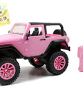 Pink Jeep Wrangler 1:16 RC Car For Kids With 2.4GHz Remote, turbo boost function, doll seat, and included decal sheet on display.