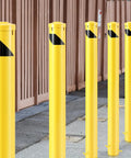 Tough As Nails 55 Inch Fully Galvanized Steel Safety Bollard Post in yellow, designed for parking lot and sidewalk protection.