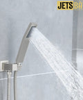 All-In-One Tub And Shower Faucet Set In Brushed Nickel With 12-Inch Rainfall Shower Head Waterfall Tub Spout And Rough-In Valve spraying water