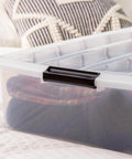 Heavy Duty 50 Quart Stackable Plastic Storage Bins With Snap Tight Secure Lids Clear Organizers For Home Office Dorm Room Garage No Sweat Bulk Pack Of Three, stacked bin with cozy blankets inside.