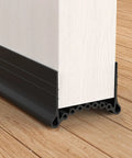 Kick Those Drafts Hella Durable Silicone Door Draft Stopper 39 Inch under door seal attached to wooden door, blocking drafts.