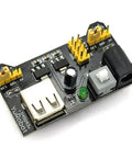 Close-up of power module from All In One Power Supply Kit For Arduino Raspberry Pi STM32 Uno Mega 2560 showing USB and power ports.