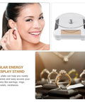 Ipetboom Battery Free Rotating Display Stand Electric Jewelry Showcase Solar Powered Turntable showing earrings and rings.