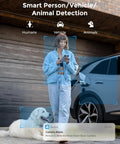 Woman using phone with smart alerts near car and dog, showcasing Outdoor WiFi Security Camera 5MP HD Plug In Night Vision Motion Detection Smart Alerts Dual Band Wireless 2 4 GHz and 5 GHz IP67 Waterproof Wired Power Supply for Home Surveillance.
