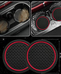 Upgrade Your Ride With This Six Piece Car Accessory Kit Packing A Slick Microfiber Steering Wheel Cover Comfy Seat Belt Pads A Soft Armrest Pad And Two Sharp Red Cup Coasters That Seriously Slap On Any Dash, featuring two black rubber cup coasters with red trim.