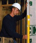 Worker using Extendable 36 Inch Level With Locking Design And Continuous Marking Edge Type 80T for precise on site measurements.