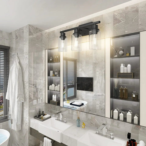 Matte Black 3 Light Vanity Light Fixtures With Clear Glass Shade in modern bathroom setting, wall-mounted sconce style