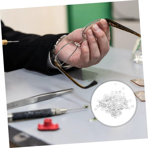 Person repairing eyeglasses with metal flat washers from kit. Metal Flat Washers For Eyeglasses Replacement Gaskets Rimless Glasses Quick Repair Kit For Sunglasses And Eyeglass Frames Includes 200 Pieces Durable And Strong Support Great For Rimless Eyewear Repairs Frames Sunglasses And Quick On The Go Fixes