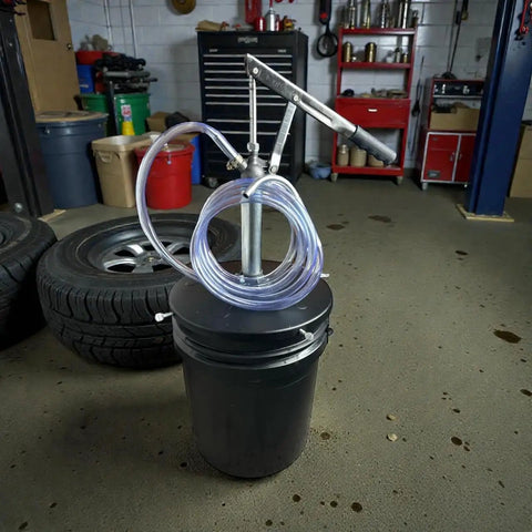 Lever Action 5 Gallon Pump For Oils And Lubricants, Self Priming, 1 Qt Per 12 Strokes, 5 Ft Hose, in garage setting