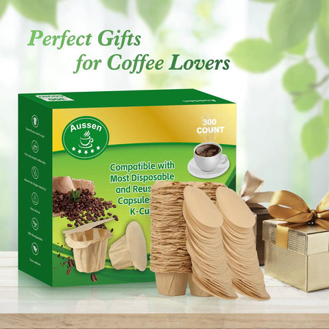 Keurig Compatible Disposable Coffee Filters 300 Pack Natural With Lid displayed with packaging and gift box on a table.
