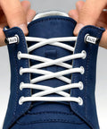 No Tie Elastic Shoe Laces With Adjustable Stretch Lock Ends For Sneakers And Casual Footwear 3 Pack Replacement Easy Slip On Daily Use Multi Color Set For A Secure Fit And Quick On The Go., white elastic no-tie laces on blue sneaker with adjustable lock ends